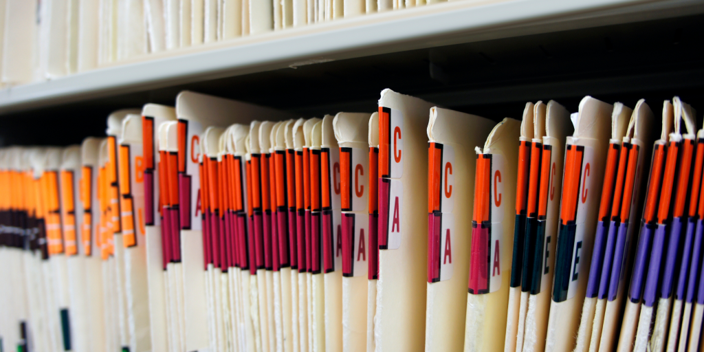 Medical files stored in a file rack that can be used for building medical chronologies. 