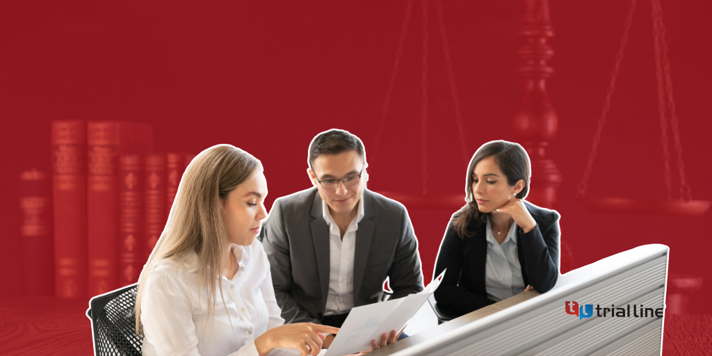 Three HR professionals in front of a computer working on a worker discrimination cases with TrialLine, a legal timeline software.